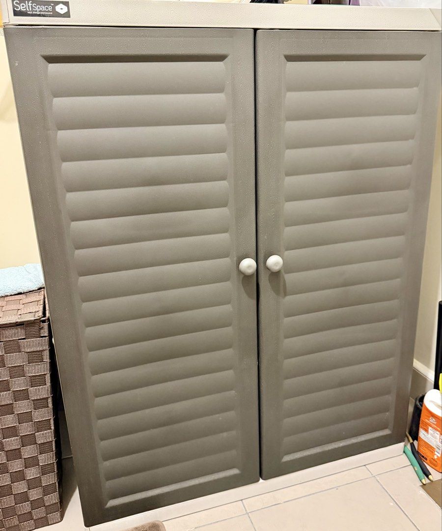 SelfSpace Grey Storage Cabinet with Double Doors (Category: Shelves, Cabinets & Racks) located in Makati City. Submitted by viajero_republic (Listing ID 1464434667, Image 1). Description: - Grey storage cabinet - Louvered double doors with round white knobs - Ideal for organizing shoes, books, or household items - Compact size, fits most spaces.
