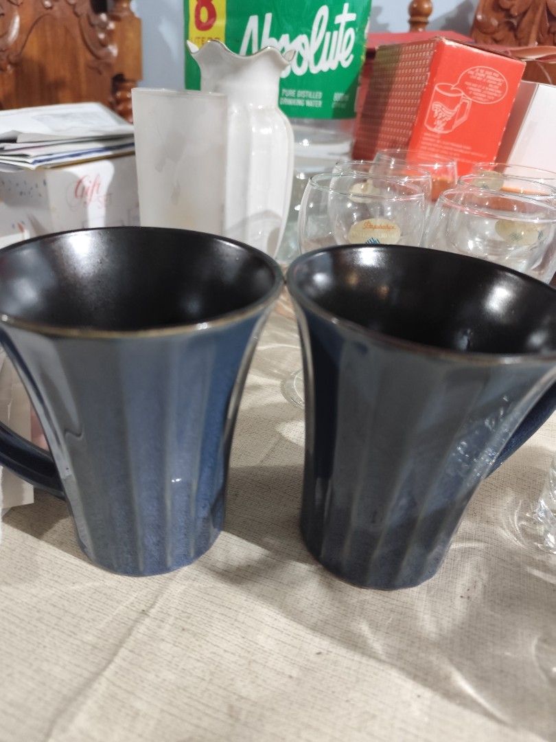 Set of 2 Blue Ceramic Mugs (Category: Coffee & Tea Tableware) located in Manila. Submitted by marriage031073advocate (Listing ID 1464453064, Image 1). Description: - Set of 2 blue ceramic mugs - Unique ribbed texture on the outside - Stylish dark interior - Perfect for coffee or tea - Dishwasher safe for easy cleaning - Japanese Mugs.
