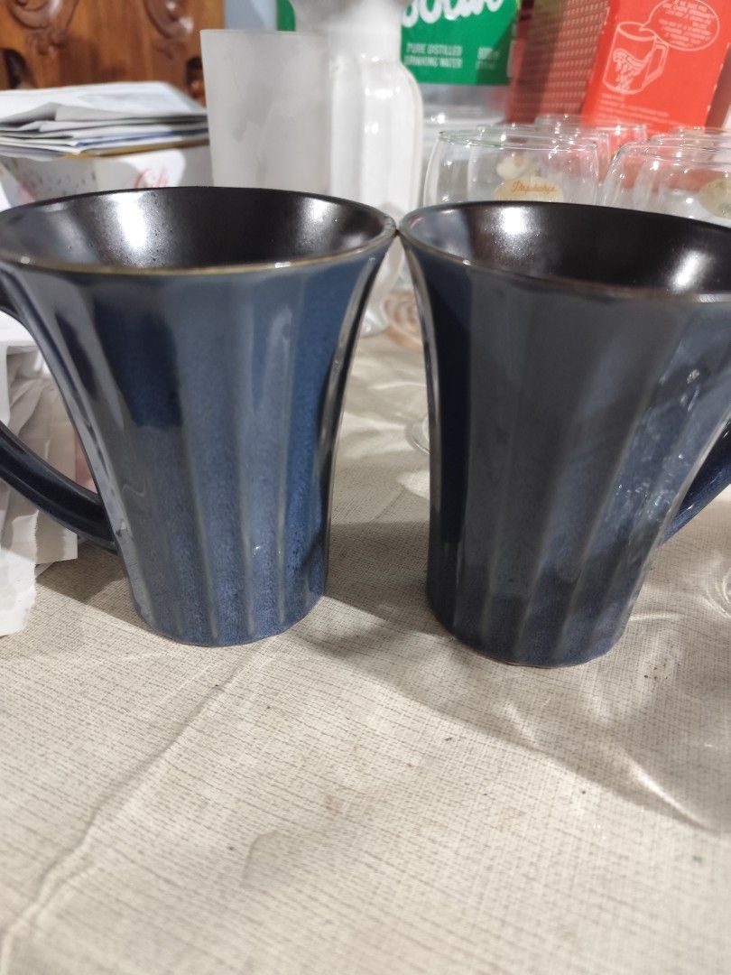 Set of 2 Blue Ceramic Mugs (Category: Coffee & Tea Tableware) located in Manila. Submitted by marriage031073advocate (Listing ID 1464453064, Image 2). Description: - Set of 2 blue ceramic mugs - Unique ribbed texture on the outside - Stylish dark interior - Perfect for coffee or tea - Dishwasher safe for easy cleaning - Japanese Mugs.