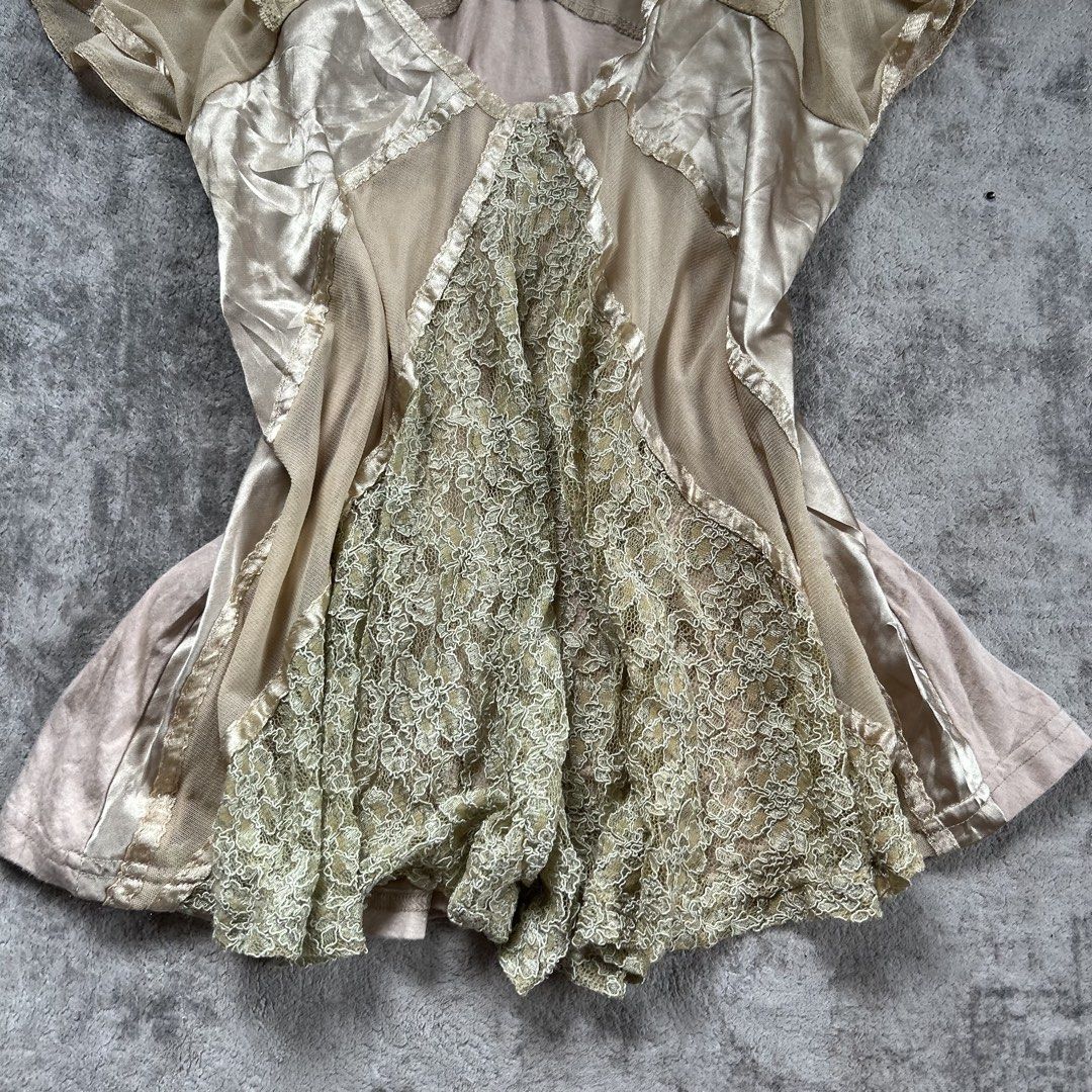 Sheer Lace & Satin Patchwork V-Neck Top fairycore whimsy (Category: Blouses) located in Davao. Submitted by read_my_abouts (Listing ID 1464465543, Image 3). Description: - size s-m Sheer mesh and satin patchwork top - Delicate lace inserts on front and sleeves - V-neckline - Fluttery short sleeves - Unique mix of textures - Great for layering or as a statement piece.