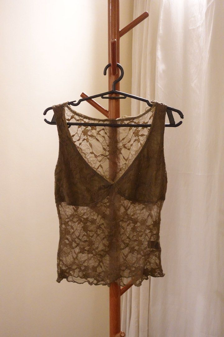 Sheer Lace V-Neck Sleeveless Top (Category: Sleeveless) located in Pasig City. Submitted by hulyascloset (Listing ID 1464544647, Image 1). Description: - Olive green lace top - V-neckline - Sleeveless design - All-over floral lace pattern - Slightly scalloped hemline - Ideal for layering over bralettes or camisoles - Features nice texture and detail.