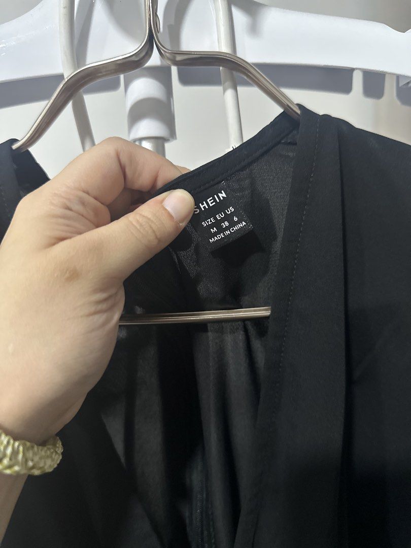 SHEIN Black Flutter Sleeve Button Front Midi Dress (Category: Dresses) located in Cavite. Submitted by prelovedbymaeve (Listing ID 1464452449, Image 3). Description: - Black midi dress from SHEIN - Flutter sleeves - Button front detail - V-neckline - Versatile: dress up or down - Size: Medium (EU/US).