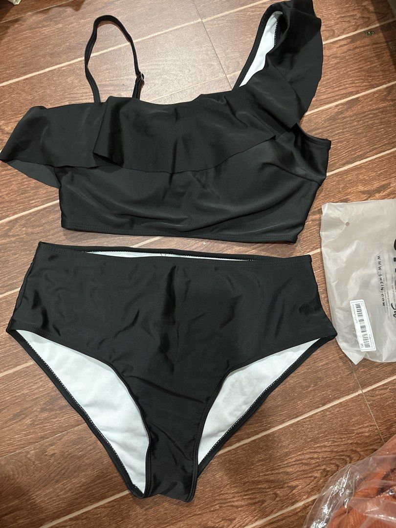 SHEIN Black One Shoulder Ruffle Bikini Set (Category: Bikinis & Swimsuits) located in Marikina City. Submitted by rctoby00 (Listing ID 1464443163, Image 1). Description: - SHEIN black one-shoulder bikini set - Features a ruffled top - High-waisted bottoms - Smooth and stretchy material - Adjustable strap on the top for a perfect fit - Ideal for beach or pool outings - Please check the size chart for accurate measurements.