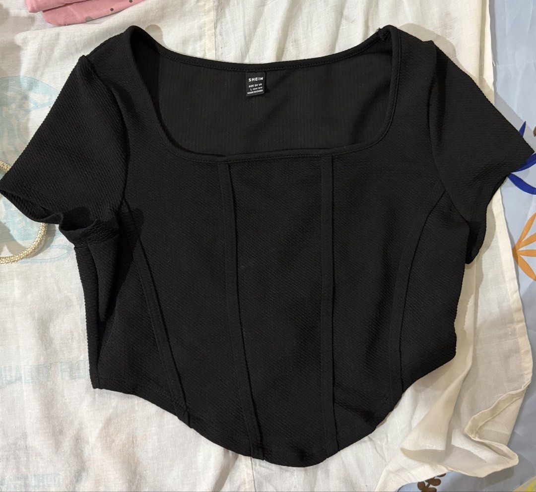 SHEIN Black Square Neck Corset Top Size L (Category: Sleeveless) located in Valenzuela. Submitted by bong1201 (Listing ID 1464483937, Image 1). Description: - SHEIN black top - Size: L - Square neckline - Short sleeves - Corset-style fit - Textured fabric - Versatile: pairs well with high-waisted jeans or skirts - Ideal for night outs or casual wear.