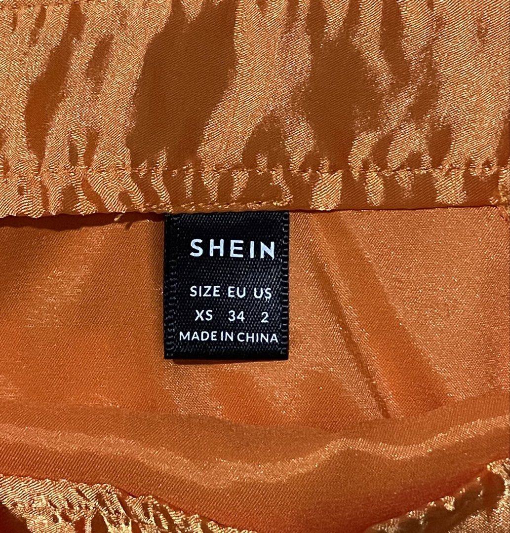Shein Bright Orange Satin Skirt (Category: Skirts) located in Paranaque City. Submitted by preloveeed890 (Listing ID 1464378904, Image 2). Description: brand new, only fitted and kept in storage .