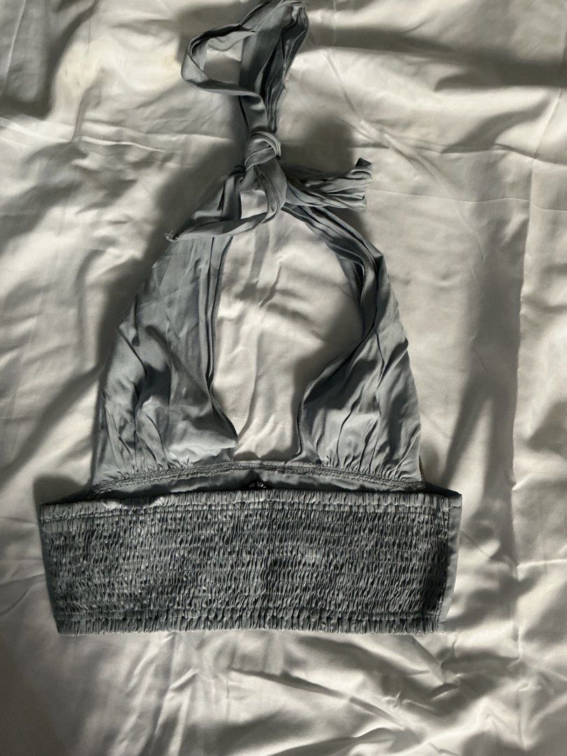 SHEIN Grey Smocked Halter Neck Crop Top (Category: Sleeveless) located in Manila. Submitted by isomarizm (Listing ID 1464400844, Image 2). Description: - Features a smocked bust for a flattering fit - Adjustable tie-back closure -Cropped loc: qc/malabon mop: gcash/maya.