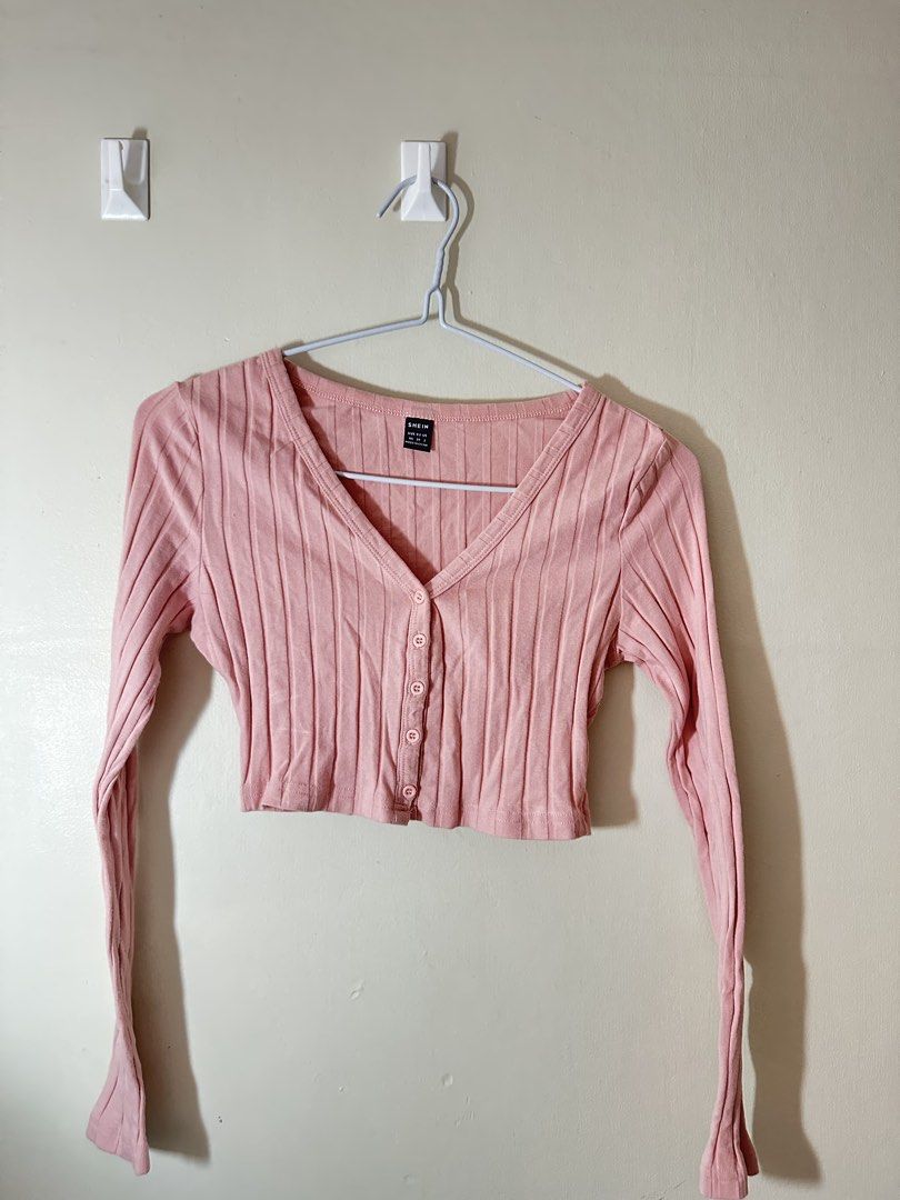 SHEIN Pink Ribbed Button-Up Cropped Cardigan (Category: Coats, Jackets and Outerwear) located in Baguio. Submitted by archivedbyj (Listing ID 1464390759, Image 1). Description: - Cute pink ribbed cardigan from SHEIN - V-neck with button-up front - Cropped length with long sleeves - Versatile for casual or dressed-up looks - Pairs well with high-waisted bottoms.