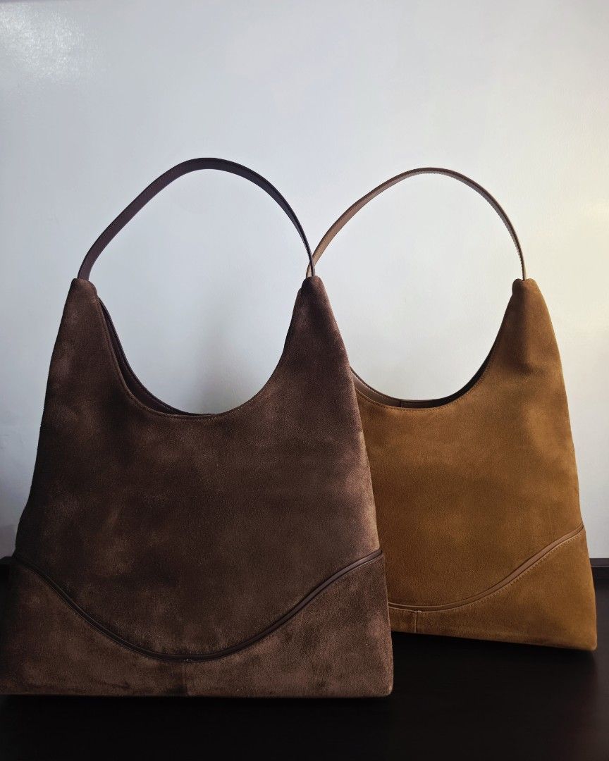 SIENA SUEDE HOBO LEATHER BAG (Category: Shoulder Bags) located in Manila. Submitted by thehushed_studio (Listing ID 1464447817, Image 2). Description: Designed with a slouchy hobo silhouette and subtle curved stitching, this new minimalist suede shoulder bag elevates your everyday style.Generously sized to fit all your daily essentials—phone, wallet, makeup pouch, water bottle, and small tablet. Colors: Warm Tan, Espresso Dark brown Material: Cow