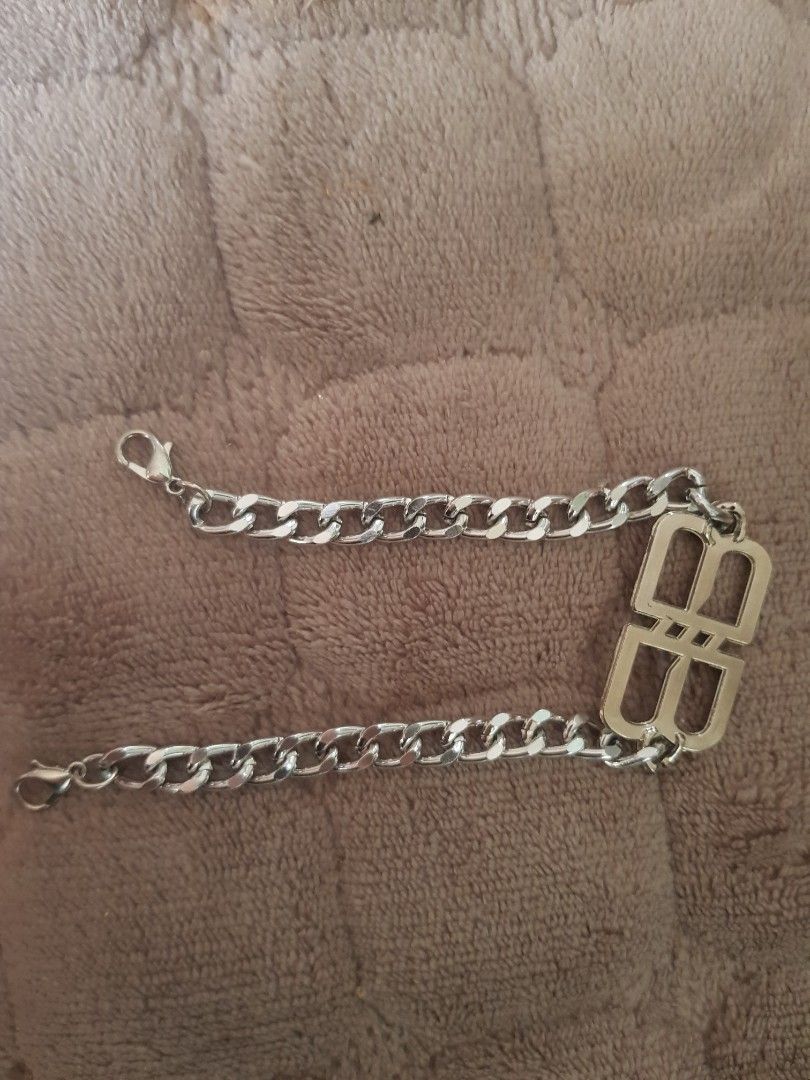 BALENCIAGA Chain Bracelet with BB Logo Clasp (Category: Luxury Accessories) located in Antipolo. Submitted by ybolavirus (Listing ID 1464372628, Image 3). Description: -Balenciaga bracelet off/legit only -from ukay - Chunky silver chain bracelet - Polished finish for extra shine - Features a prominent BB logo clasp - Secure lobster clasp closure - A stylish accessory to elevate any look.