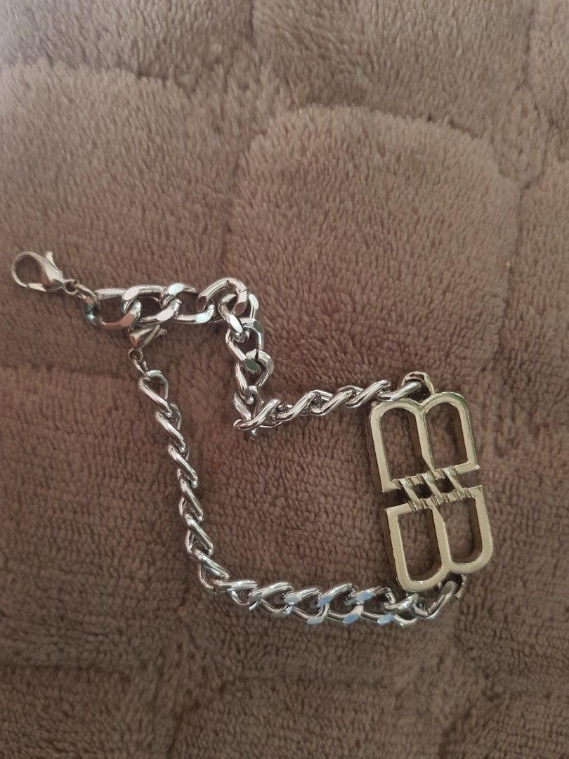BALENCIAGA Chain Bracelet with BB Logo Clasp (Category: Luxury Accessories) located in Antipolo. Submitted by ybolavirus (Listing ID 1464372628, Image 2). Description: -Balenciaga bracelet off/legit only -from ukay - Chunky silver chain bracelet - Polished finish for extra shine - Features a prominent BB logo clasp - Secure lobster clasp closure - A stylish accessory to elevate any look.