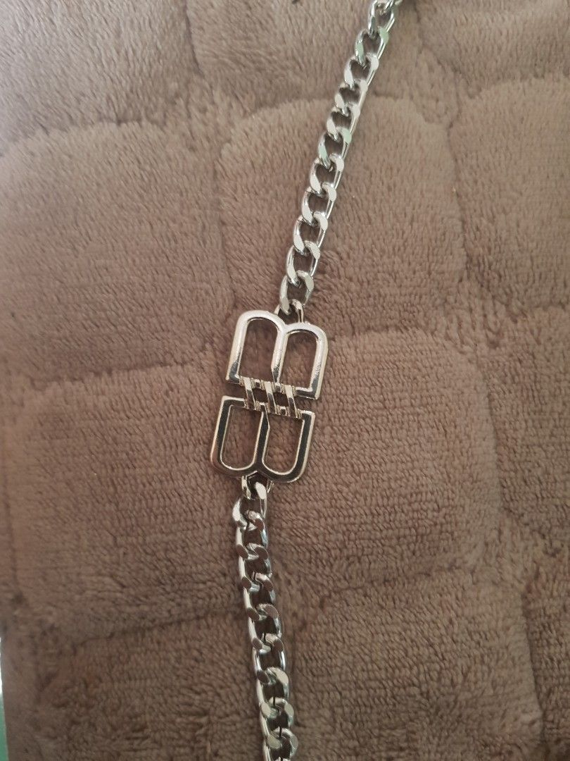 BALENCIAGA Chain Bracelet with BB Logo Clasp (Category: Luxury Accessories) located in Antipolo. Submitted by ybolavirus (Listing ID 1464372628, Image 1). Description: -Balenciaga bracelet off/legit only -from ukay - Chunky silver chain bracelet - Polished finish for extra shine - Features a prominent BB logo clasp - Secure lobster clasp closure - A stylish accessory to elevate any look.