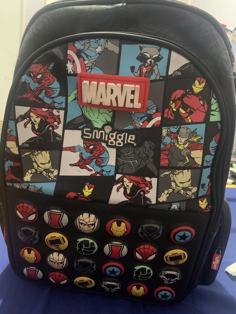 Smiggle Marvel Avengers Backpack with Character Badges (Category: Backpacks) located in Malabon City. Submitted by eeroc (Listing ID 1464567862, Image 1). Description: - Official Smiggle backpack featuring a vibrant Marvel superhero design. - Includes popular characters: Spider-Man, Iron Man, Captain America, Hulk, Thor, Black Widow, Groot, and Rocket Raccoon. - Adorned with fun, collectible character badges on the front pocket. - Smooth-gliding 