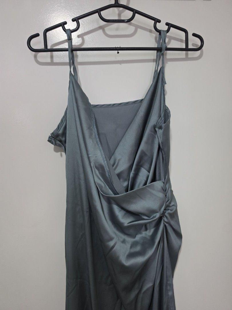 Solid Satin Slit Midi Dress (Category: Dresses) located in Santa Rosa. Submitted by marionette2728 (Listing ID 1464370972, Image 3). Description: ORIG PRICE: 1,220 - Elegant grey satin slip dress - Features a stylish twist front detail at the bust - Delicate spaghetti straps - Flattering midi length - Smooth and silky material for a luxurious feel - Ideal for a night out or special occasions.