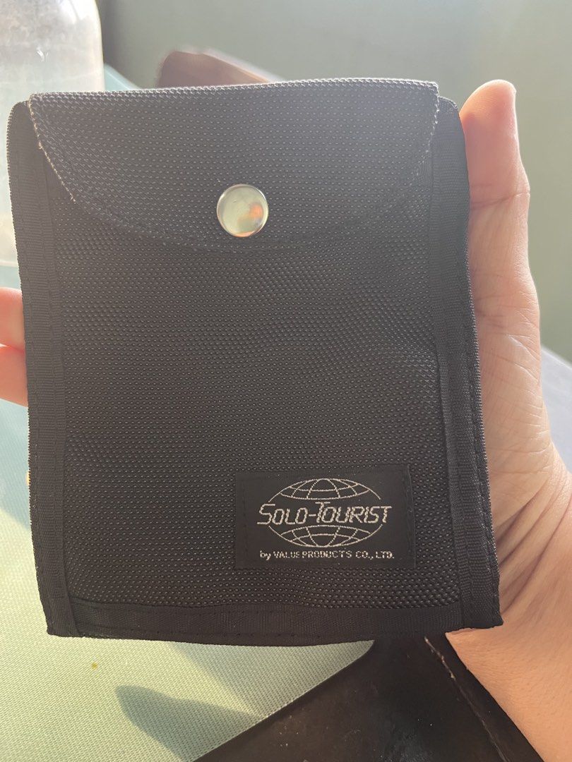 Solo-Tourist Passport Wallet (Category: Belt bags, Clutches and Pouches) located in Pasay City. Submitted by beye01 (Listing ID 1464437714, Image 1). Description: The lidded pocket on the front fits your passport perfectly. There are three pockets on the inside: two open pockets large enough to hold A4 folded in three, and one zippered pocket large enough to hold bills. There are also three card pockets and one zippered mesh pocket. Behind these 
