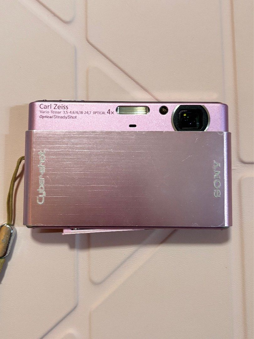 Sony Cyber-shot DSC-T77 Pink Digital Camera (Category: Cameras) located in Manila. Submitted by haelpark060024 (Listing ID 1464386435, Image 1). Description: Sony Cyber-shot DSC-T77 Pink - 10.1 megapixels - Comes with the unit, Sony battery, charger, and universal card reader - Please see the 2nd–4th photos for the issues: loose battery door, signs of usage, and LCD burn. LCD burn does not affect the touchscreen function or image output. - MOP: G