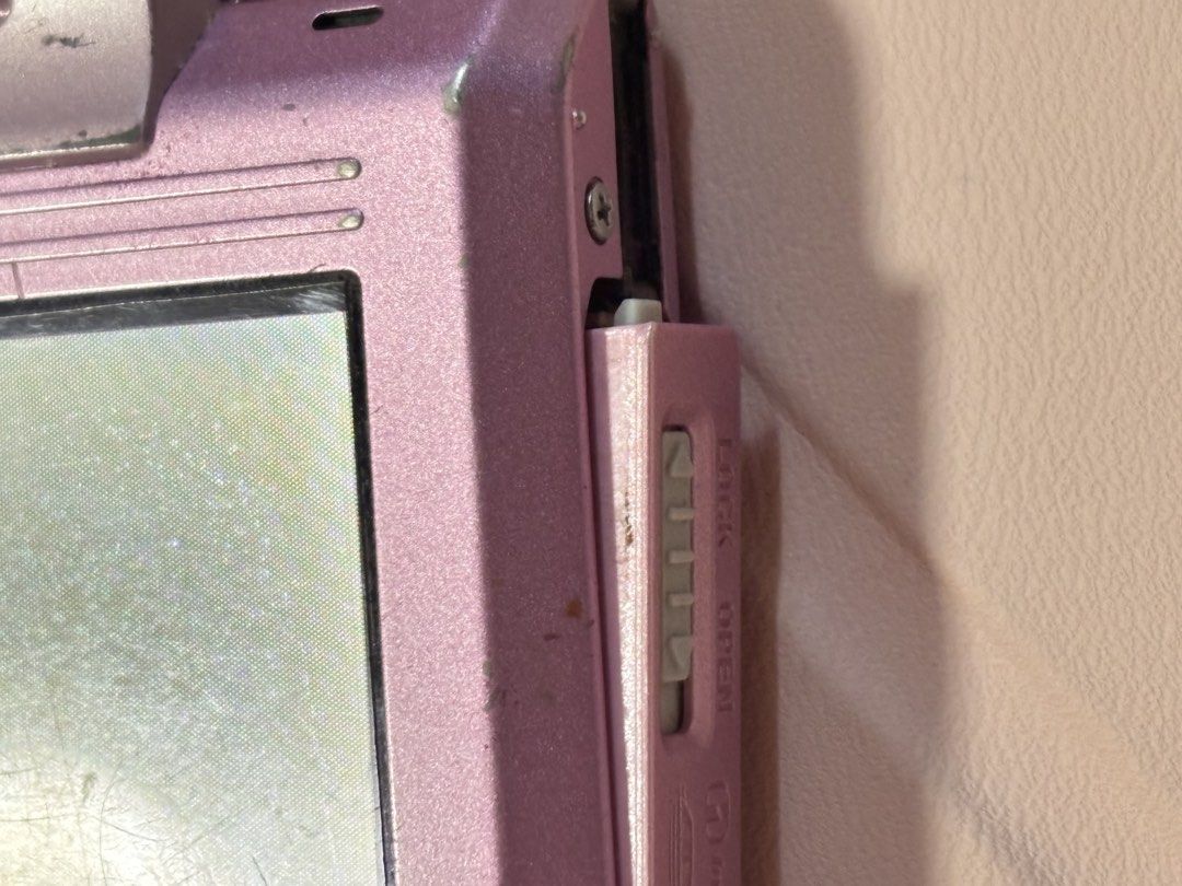 Sony Cyber-shot DSC-T77 Pink Digital Camera (Category: Cameras) located in Manila. Submitted by haelpark060024 (Listing ID 1464386435, Image 3). Description: Sony Cyber-shot DSC-T77 Pink - 10.1 megapixels - Comes with the unit, Sony battery, charger, and universal card reader - Please see the 2nd–4th photos for the issues: loose battery door, signs of usage, and LCD burn. LCD burn does not affect the touchscreen function or image output. - MOP: G
