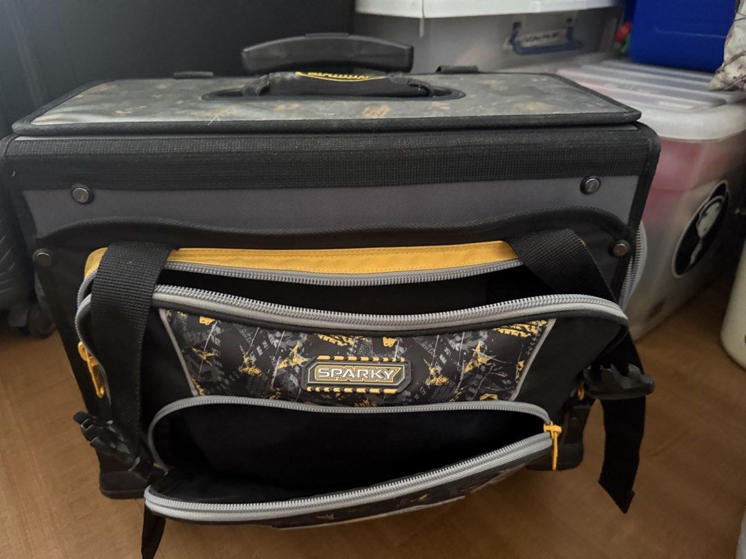Sparky Rolling Tool Bag with Wheels (Category: Construction Tools & Equipment) located in Quezon City. Submitted by krisallie (Listing ID 1464460601, Image 1). Description: - Sparky rolling tool bag in black and yellow. - Multiple compartments and pockets for excellent organization. - Telescoping handle and wheels for effortless transport. - Ideal for storing and carrying all your tools. - Shows some signs of wear and tear from use, but remains h