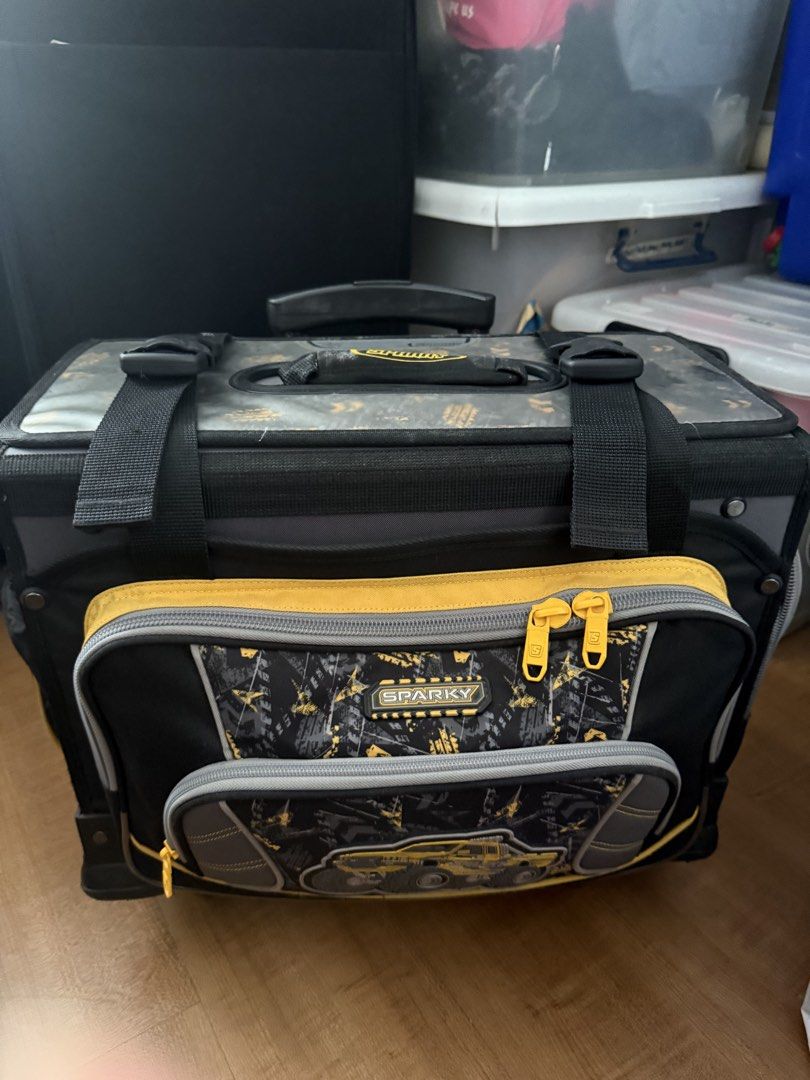 Sparky Rolling Tool Bag with Wheels (Category: Construction Tools & Equipment) located in Quezon City. Submitted by krisallie (Listing ID 1464460601, Image 2). Description: - Sparky rolling tool bag in black and yellow. - Multiple compartments and pockets for excellent organization. - Telescoping handle and wheels for effortless transport. - Ideal for storing and carrying all your tools. - Shows some signs of wear and tear from use, but remains h