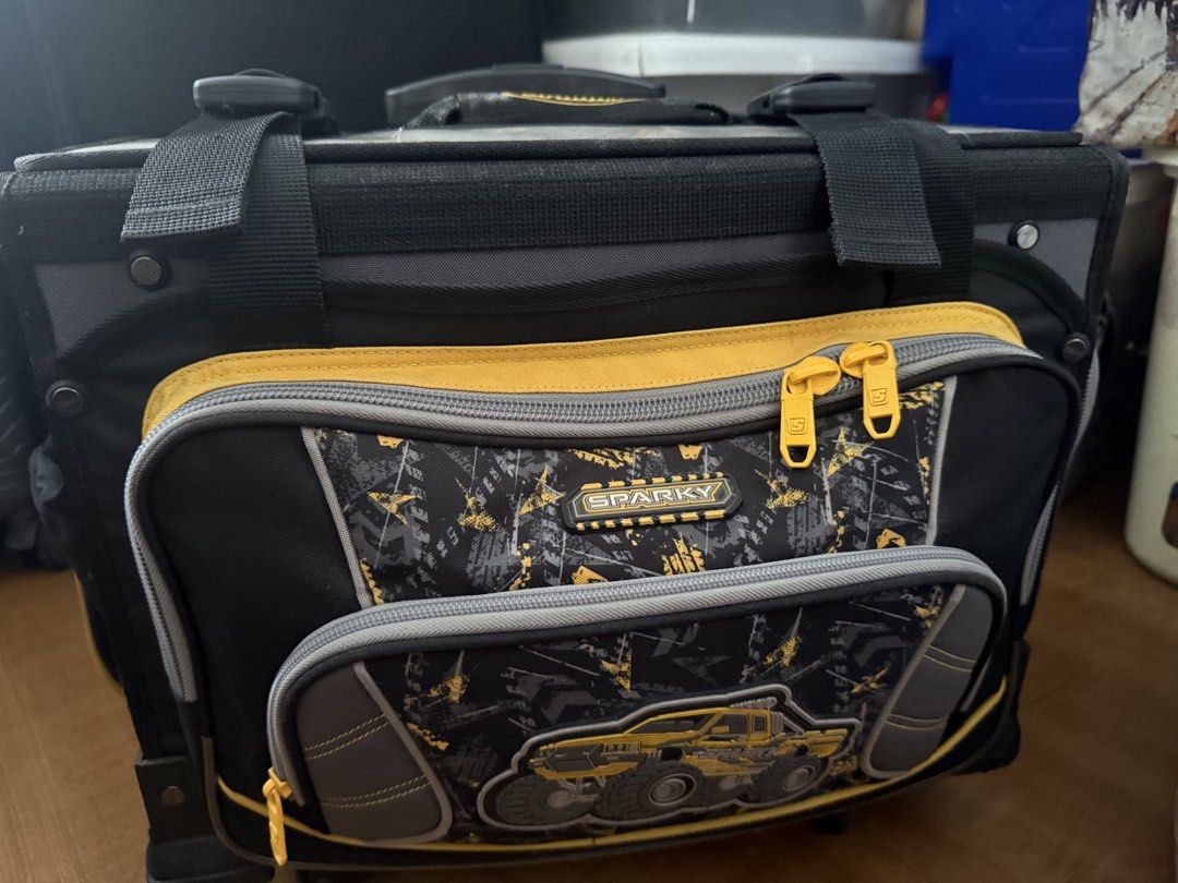 Sparky Rolling Tool Bag with Wheels (Category: Construction Tools & Equipment) located in Quezon City. Submitted by krisallie (Listing ID 1464460601, Image 3). Description: - Sparky rolling tool bag in black and yellow. - Multiple compartments and pockets for excellent organization. - Telescoping handle and wheels for effortless transport. - Ideal for storing and carrying all your tools. - Shows some signs of wear and tear from use, but remains h