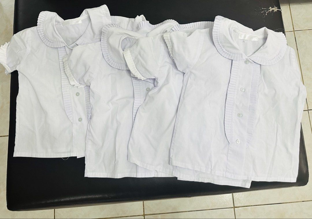 St. Scholasticas Academy Uniform set (Category: Everything Else Others) located in San Fernando. Submitted by wise_royaldragon.605ce7 (Listing ID 1464361389, Image 2). Description: - Set of school uniforms - Includes dark blue pleated pinafore skirts with adjustable straps - Includes white short-sleeved blouses with Peter Pan collars - Multiple sets available - Great for students - Please check photos for details.