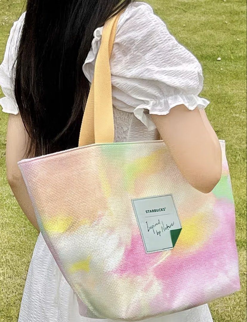 Starbucks Nature Tote Bag (Category: Tote Bags) located in Manila. Submitted by shayne2 (Listing ID 1464427544, Image 3). Description: - Adorable pastel tie-dye Starbucks tote bag - Features light yellow handles - Ideal for everyday use or as a small travel bag - Lightweight and easy to carry - A unique Starbucks accessory to grab!.