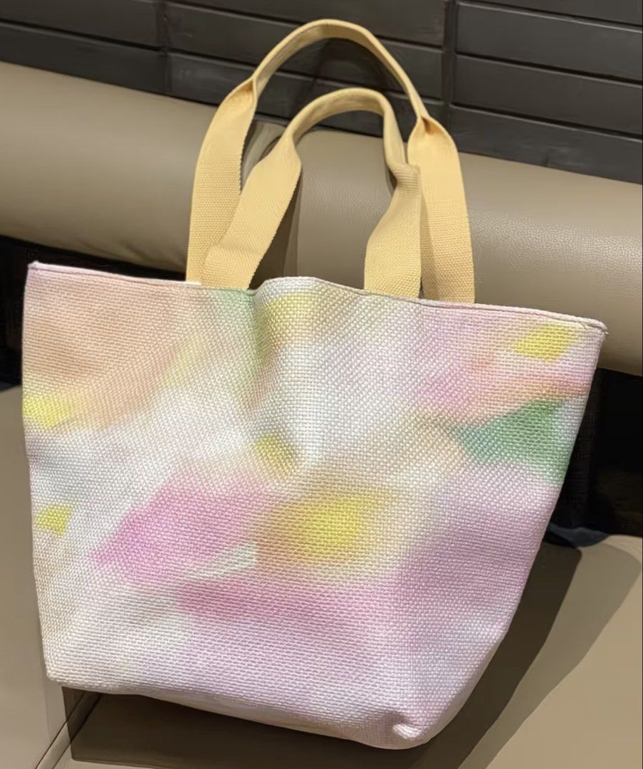 Starbucks Nature Tote Bag (Category: Tote Bags) located in Manila. Submitted by shayne2 (Listing ID 1464427544, Image 2). Description: - Adorable pastel tie-dye Starbucks tote bag - Features light yellow handles - Ideal for everyday use or as a small travel bag - Lightweight and easy to carry - A unique Starbucks accessory to grab!.