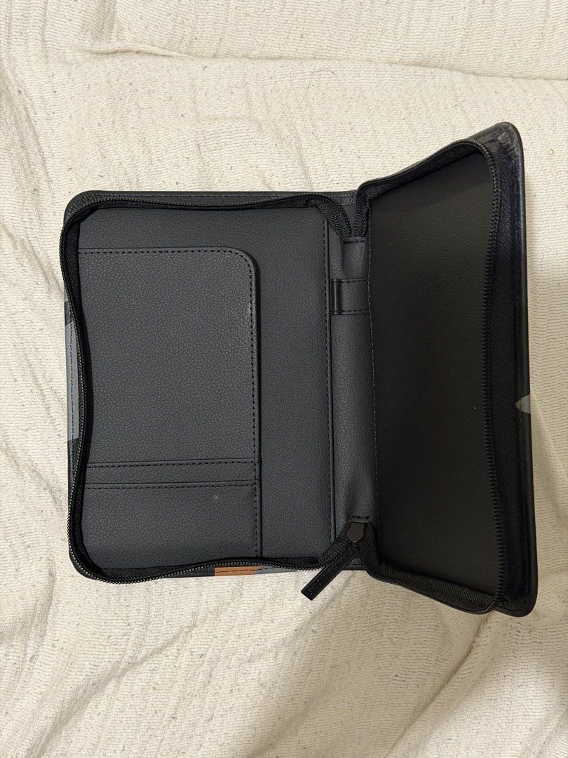 Starbucks Planner Cover with Pockets (Category: Stationery & School Supplies) located in Quezon City. Submitted by allthingspreloved.ph (Listing ID 1464556707, Image 2). Description: - Sleek black Starbucks planner cover - Features a cool abstract design - Iconic Starbucks logo on the front - Interior pockets for cards or notes - Secure zipper closure - Ideal for organizing your planner or travel documents.
