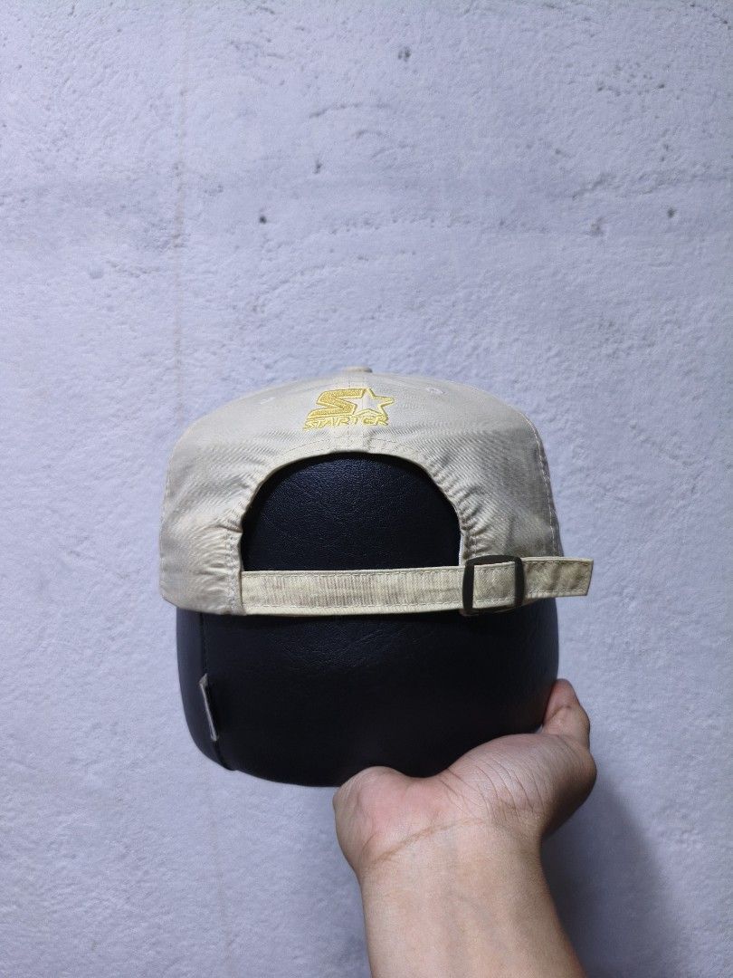 Starter Nylon Brown Brim Cap (Category: Caps & Hats) located in Malilipot. Submitted by aronbigorn96320 (Listing ID 1464489495, Image 2). Description: - Beige Starter cap - Brown suede brim - Yellow embroidered Starter logo on front - Adjustable strap at the back - Made of 100% nylon - Ideal for everyday wear.