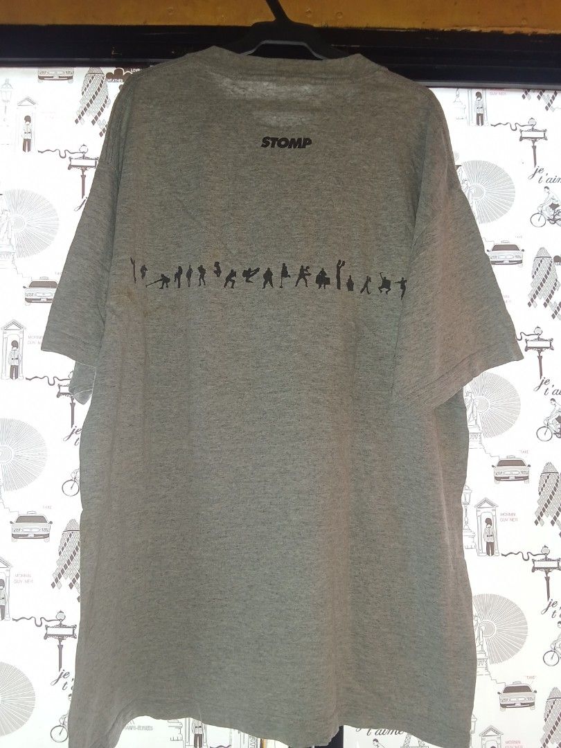 STOMP Grey T-shirt with Graphic Print (Category: Tshirts & Polo Shirts ) located in Bacolod City. Submitted by vaststar.8be4bd (Listing ID 1464415621, Image 2). Description: - Grey cotton t-shirt - Features 'STOMP' graphic on the front - 'STOMP' logo and silhouette figures on the back - Comfortable for casual wear.
