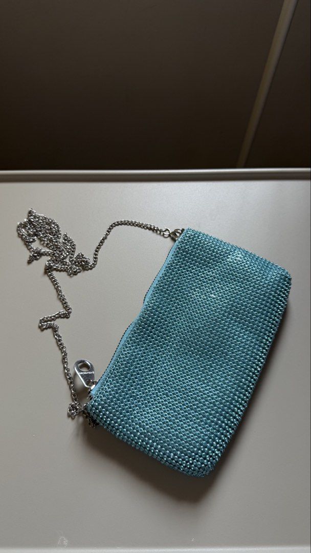 Stradivarius Chain Bag (Category: Clutches) located in Muntinlupa City. Submitted by miss.sb (Listing ID 1464386523, Image 1). Description: Teal tiffany blue beaded clutch bag with Silver chain strap Buyer own booking Taguig/ Muntinlupa Area Bpi gcash maya .