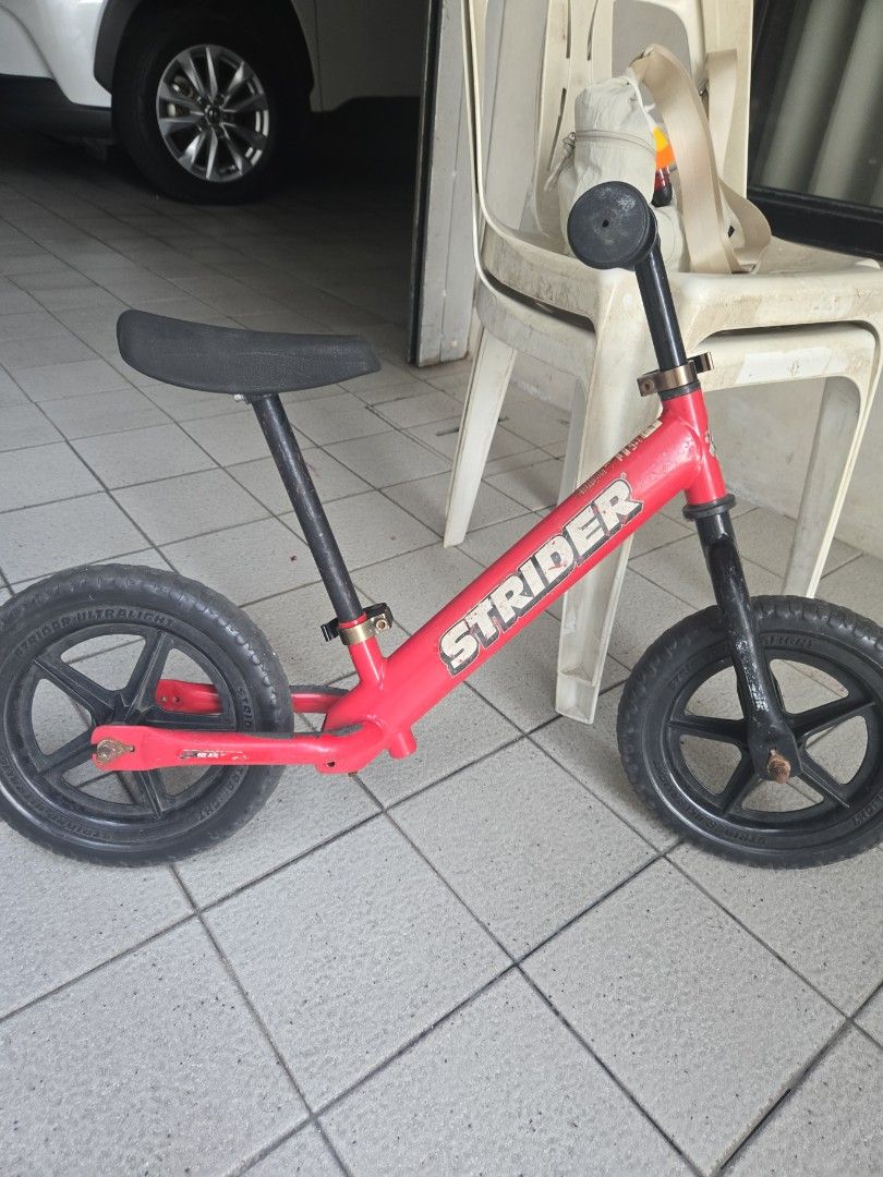 Strider Balance Bike (Category: Bicycles) located in Pasig City. Submitted by izzy0202 (Listing ID 1464429028, Image 1). Description: - Strider balance bike in vibrant red - Ultralight model for easy handling - Ideal for toddlers developing balance skills - Minor cosmetic scuffs on the frame from normal use - Ready for its next adventure with a new rider!.