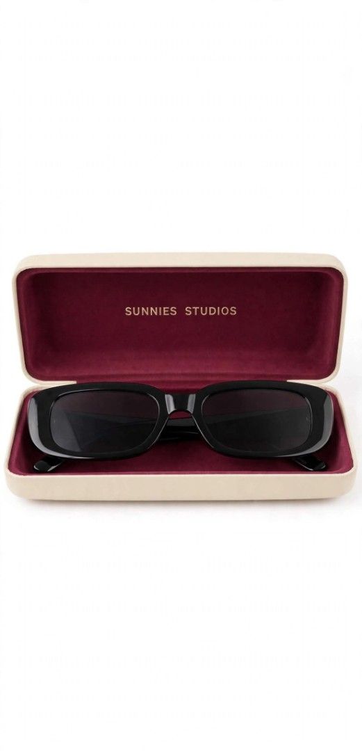 SUNNIES STUDIOS Black Rectangular Sunglasses with Case (Category: Sunglasses & Eyewear) located in Manila. Submitted by roseannlmn66895 (Listing ID 1464400003, Image 1). Description: *Sunnies Studios Sunglasses - Black* Brand: Sunnies Studios - original Style: Rectangle / Y2K shades Color: Glossy black frame, black lens Inclusion: Hard case - cream with burgundy inside, may gold emboss na SUNNIES STUDIOS Condition: Good, malinis lens, no scratch,