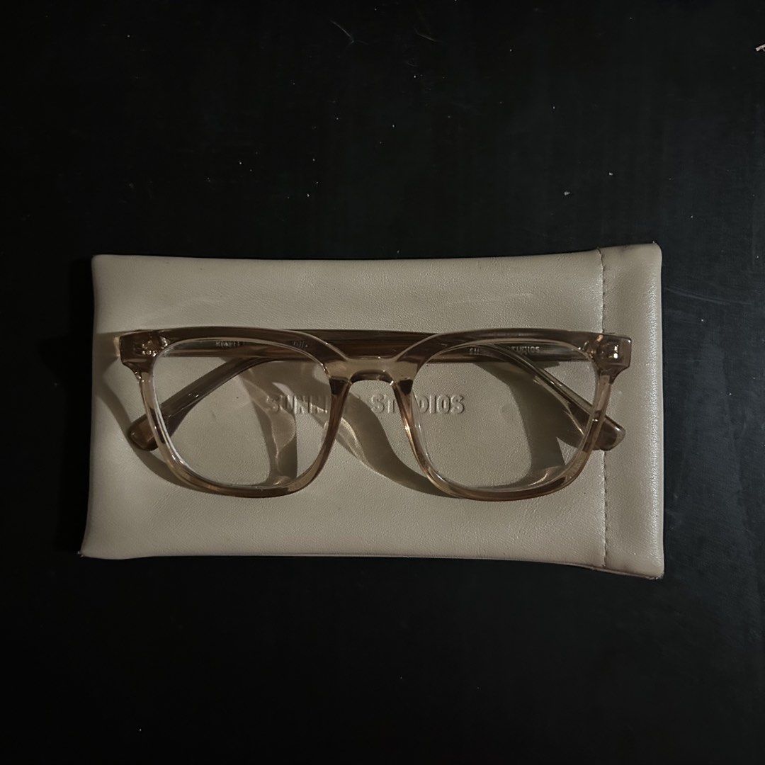 Sunnies Studios River Optical Frames with Case (Category: Sunglasses & Eyewear) located in Manila. Submitted by depop_bella (Listing ID 1464399304, Image 3). Description: - Brand: Sunnies Studios - Color: Light brown/tan - Lenses: Clear (ready for prescription) - Includes: Soft case - Features: Embossed brand name on inside arm - Ideal for: Everyday wear, new prescription glasses.