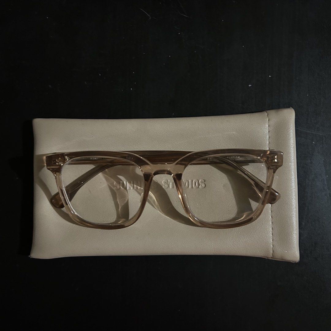 Sunnies Studios River Optical Frames with Case (Category: Sunglasses & Eyewear) located in Manila. Submitted by depop_bella (Listing ID 1464399304, Image 1). Description: - Brand: Sunnies Studios - Color: Light brown/tan - Lenses: Clear (ready for prescription) - Includes: Soft case - Features: Embossed brand name on inside arm - Ideal for: Everyday wear, new prescription glasses.