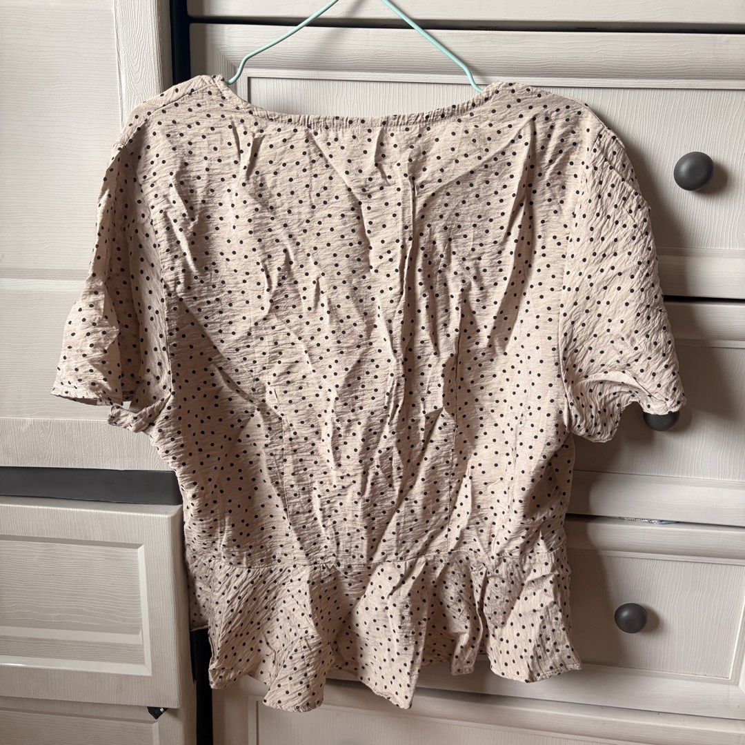 Take all Anko Tops (Category: Blouses) located in Makati City. Submitted by iu__00 (Listing ID 1464391720, Image 2). Description: - Beige blouse with classic black polka dots - Size: Medium to Large - Short sleeves for a comfortable fit - Flattering V-neckline with functional button-up front - Stylish peplum hem detail adds a feminine touch - Made from lightweight fabric, perfect for all-day wear - Ideal for both casual outings and dressing up fo