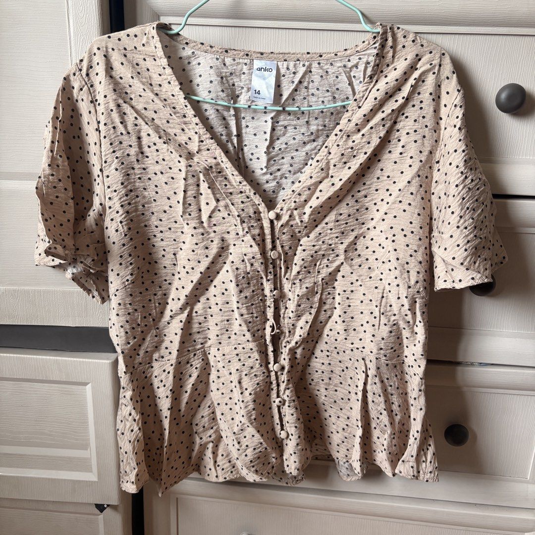 Take all Anko Tops (Category: Blouses) located in Makati City. Submitted by iu__00 (Listing ID 1464391720, Image 1). Description: - Beige blouse with classic black polka dots - Size: Medium to Large - Short sleeves for a comfortable fit - Flattering V-neckline with functional button-up front - Stylish peplum hem detail adds a feminine touch - Made from lightweight fabric, perfect for all-day wear - Ideal for both casual outings and dressing up fo