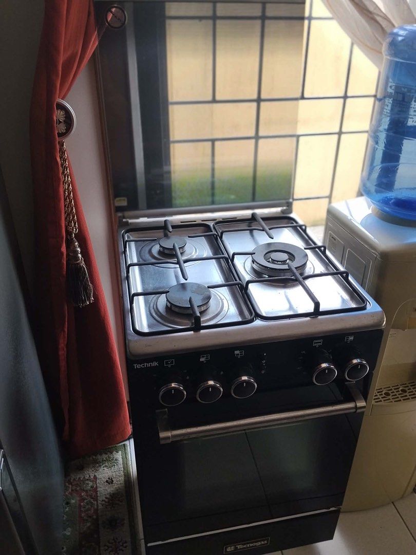 Technik 3-Burner Gas Stove Oven (Category: Cookware & Accessories) located in Manila. Submitted by ammatias6172384 (Listing ID 1464450484, Image 2). Description: - Technik 4-burner gas stove with oven - Works well, reliable performance - Includes a convenient glass lid for the stovetop - Ideal size for small kitchens - Easy-to-use controls for simple operation - Oven door comes with a handle for easy access - Selling because of an upgrade to a ne