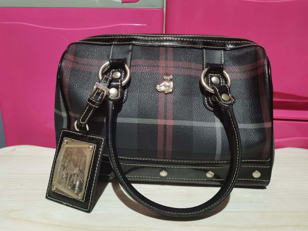 Teenie Weenie Handle Bag (Category: Luxury Bags & Wallets) located in Paete. Submitted by xiaochao.16 (Listing ID 1464363033, Image 2). Description: PRODUCT DETAILS: Add a classic preppy vibe to your look with this stunning Teenie Weenie Tartan Plaid Boston Bag! This structured doctor-style handbag features the brand's iconic dark charcoal plaid pattern intersecting with red and grey lines. It is perfectly complemented by sleek black faux-leather
