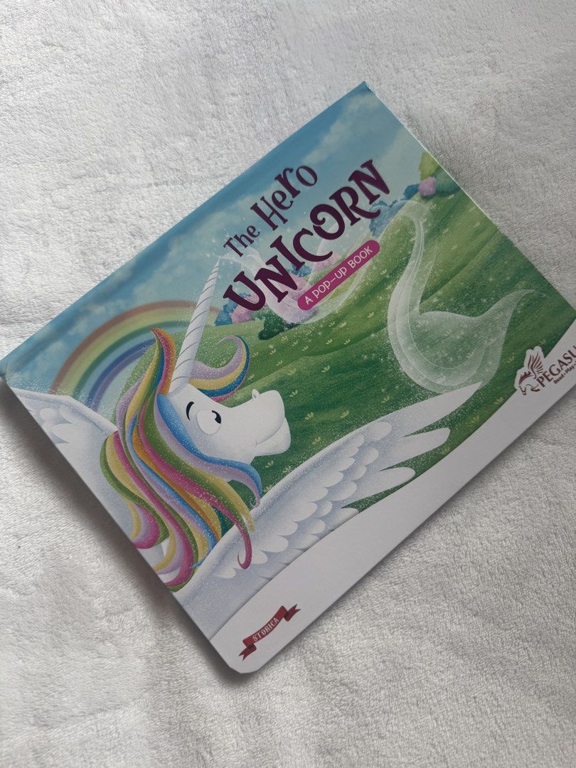 The Hero Unicorn A Pop-Up Book (Category: Children's Books) located in Daraga. Submitted by iamsupershein (Listing ID 1464387512, Image 1). Description: - Hero Unicorn Pop-Up Book - Features a colorful unicorn with rainbow mane and wings - Fun and engaging for kids - Published by Pegasus - From the Storica collection.