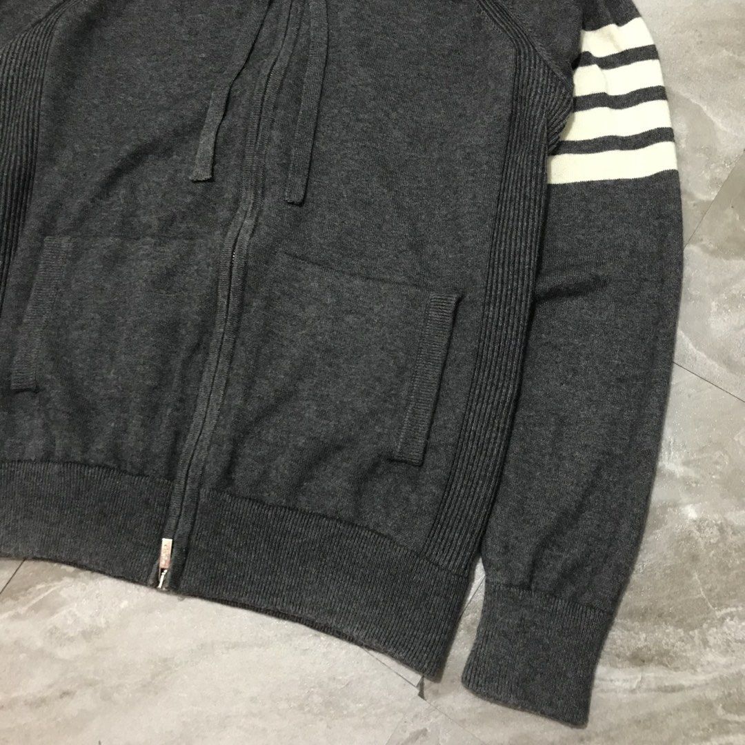Thom Browne Wool Zip-Up Hoodie (Category: Coats, Jackets and Outerwear) located in Bacoor. Submitted by thrift2dough (Listing ID 1464369029, Image 2). Description: Thom Browne Wool Zip-Up Hoodie Size: Medium Condition: 9/10 Issue: light stain Dimensions Width: 21.5" Length: 26" 2,000 + shipping fee Color may vary due to lighting Direct message if you are interested 📥.