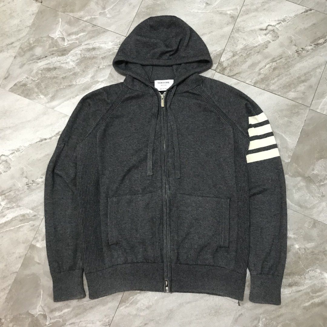 Thom Browne Wool Zip-Up Hoodie (Category: Coats, Jackets and Outerwear) located in Bacoor. Submitted by thrift2dough (Listing ID 1464369029, Image 1). Description: Thom Browne Wool Zip-Up Hoodie Size: Medium Condition: 9/10 Issue: light stain Dimensions Width: 21.5" Length: 26" 2,000 + shipping fee Color may vary due to lighting Direct message if you are interested 📥.