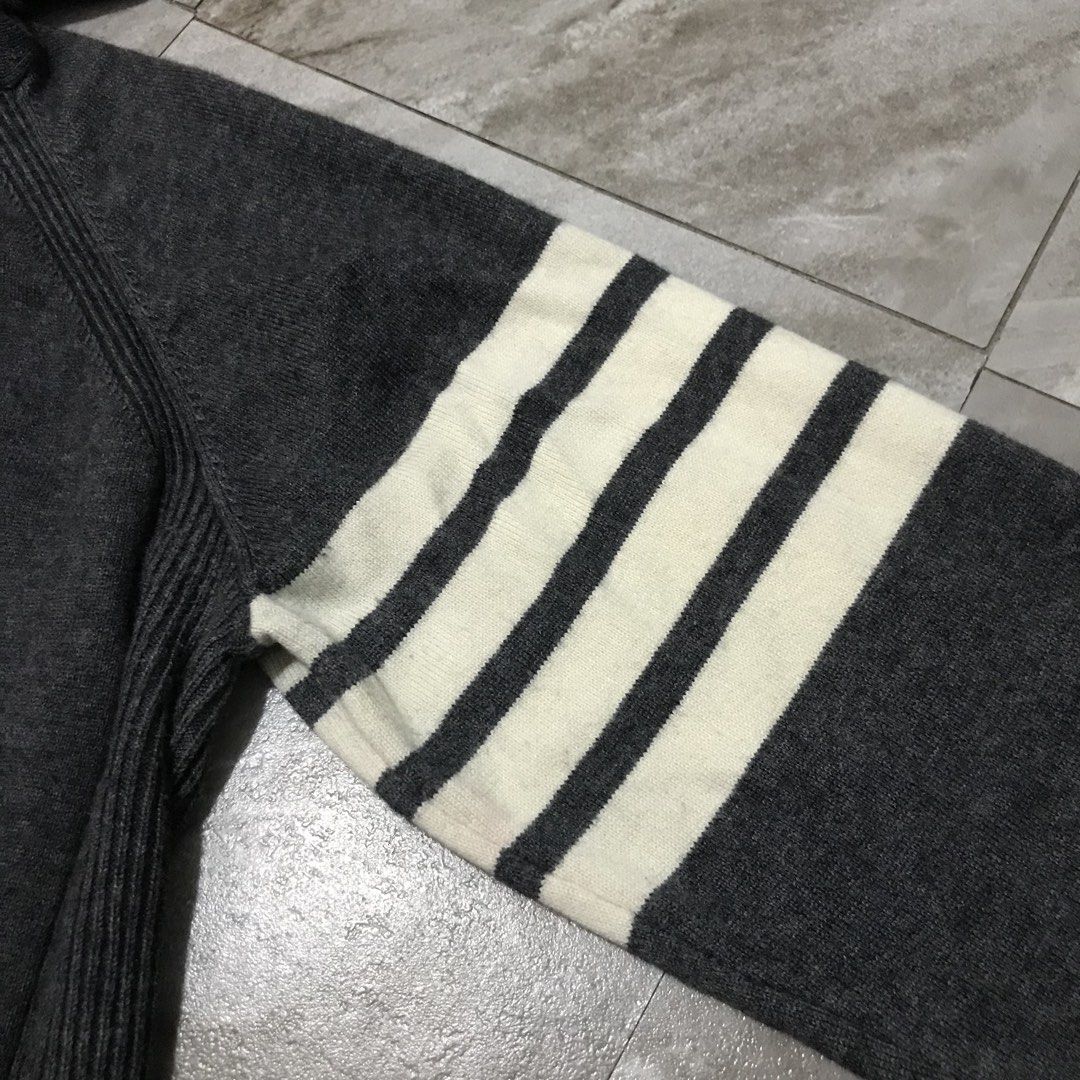 Thom Browne Wool Zip-Up Hoodie (Category: Coats, Jackets and Outerwear) located in Bacoor. Submitted by thrift2dough (Listing ID 1464369029, Image 3). Description: Thom Browne Wool Zip-Up Hoodie Size: Medium Condition: 9/10 Issue: light stain Dimensions Width: 21.5" Length: 26" 2,000 + shipping fee Color may vary due to lighting Direct message if you are interested 📥.