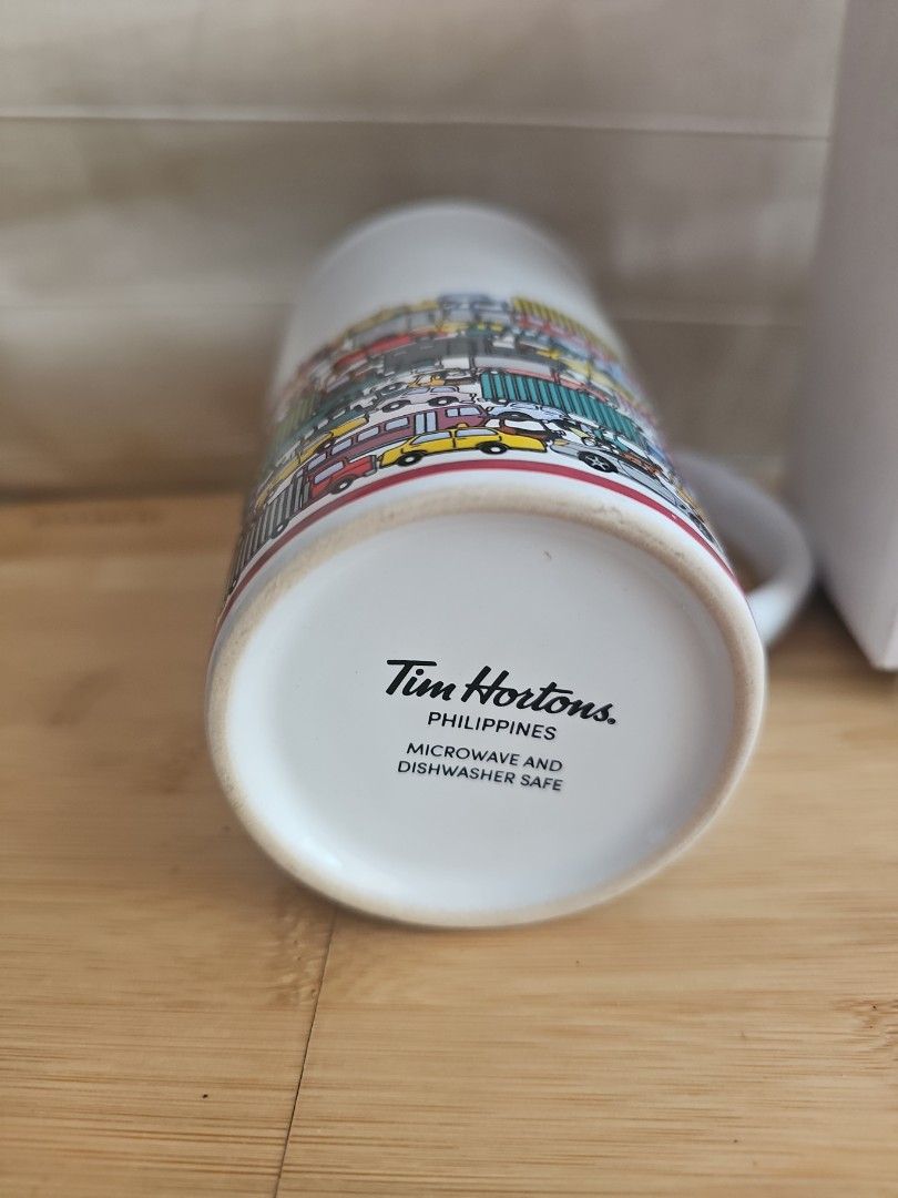 2017 Tim Hortons Philippines Traffic Mug with Box (Category: Coffee & Tea Tableware) located in Muntinlupa City. Submitted by shoptitak (Listing ID 1464380943, Image 3). Description: - Authentic Tim Hortons mug from the Philippines - Features a fun, all-over traffic design - Includes box - Ideal for enjoying your morning coffee or tea.