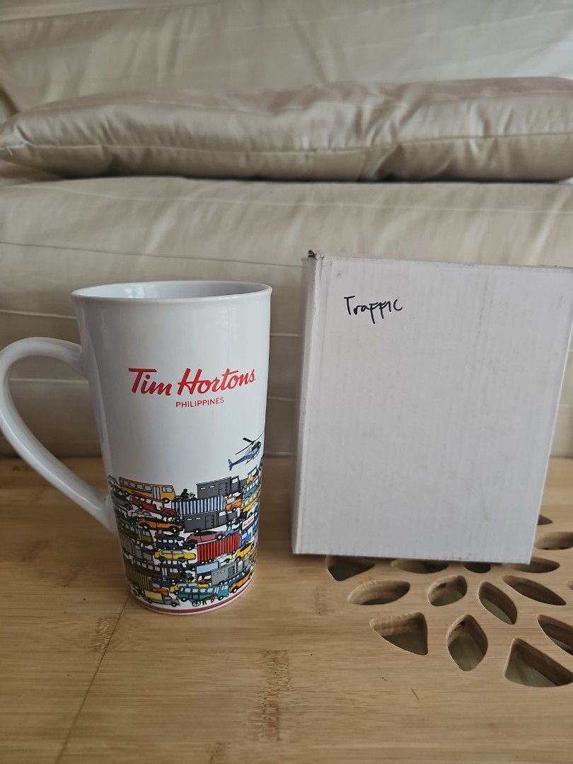 2017 Tim Hortons Philippines Traffic Mug with Box (Category: Coffee & Tea Tableware) located in Muntinlupa City. Submitted by shoptitak (Listing ID 1464380943, Image 2). Description: - Authentic Tim Hortons mug from the Philippines - Features a fun, all-over traffic design - Includes box - Ideal for enjoying your morning coffee or tea.