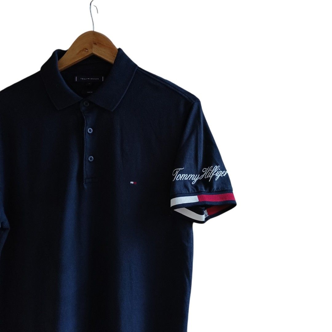TOMMY HILFIGER (Category: Tshirts & Polo Shirts ) located in Paranaque City. Submitted by AlwaysOpen (Listing ID 1464466156, Image 2). Description: TOMMY HILFIGER EMBROIDERED SCRIPT ON SLEEVES SIZE MED ( 20x27 ) EXCELLENT CONDITION / NO ISSUES 650+SF .