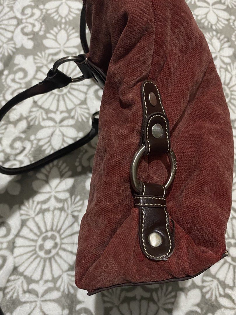 Tommy Hilfiger Red Suede Tote Bag (Category: Tote Bags) located in Manila. Submitted by mysticcat15 (Listing ID 1464502135, Image 2). Description: mop: gcash/bank transfer mod: jnt - Brand: Tommy Hilfiger - Material: Red suede with dark brown leather handles and trim - Hardware: Silver details on the sides - Interior: Maroon lining - Features: Plenty of space, great for everyday use flaws on the pic.