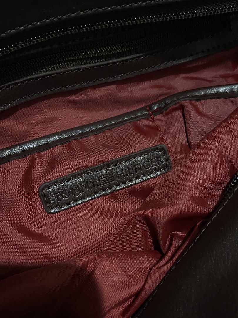 Tommy Hilfiger Red Suede Tote Bag (Category: Tote Bags) located in Manila. Submitted by mysticcat15 (Listing ID 1464502135, Image 3). Description: mop: gcash/bank transfer mod: jnt - Brand: Tommy Hilfiger - Material: Red suede with dark brown leather handles and trim - Hardware: Silver details on the sides - Interior: Maroon lining - Features: Plenty of space, great for everyday use flaws on the pic.