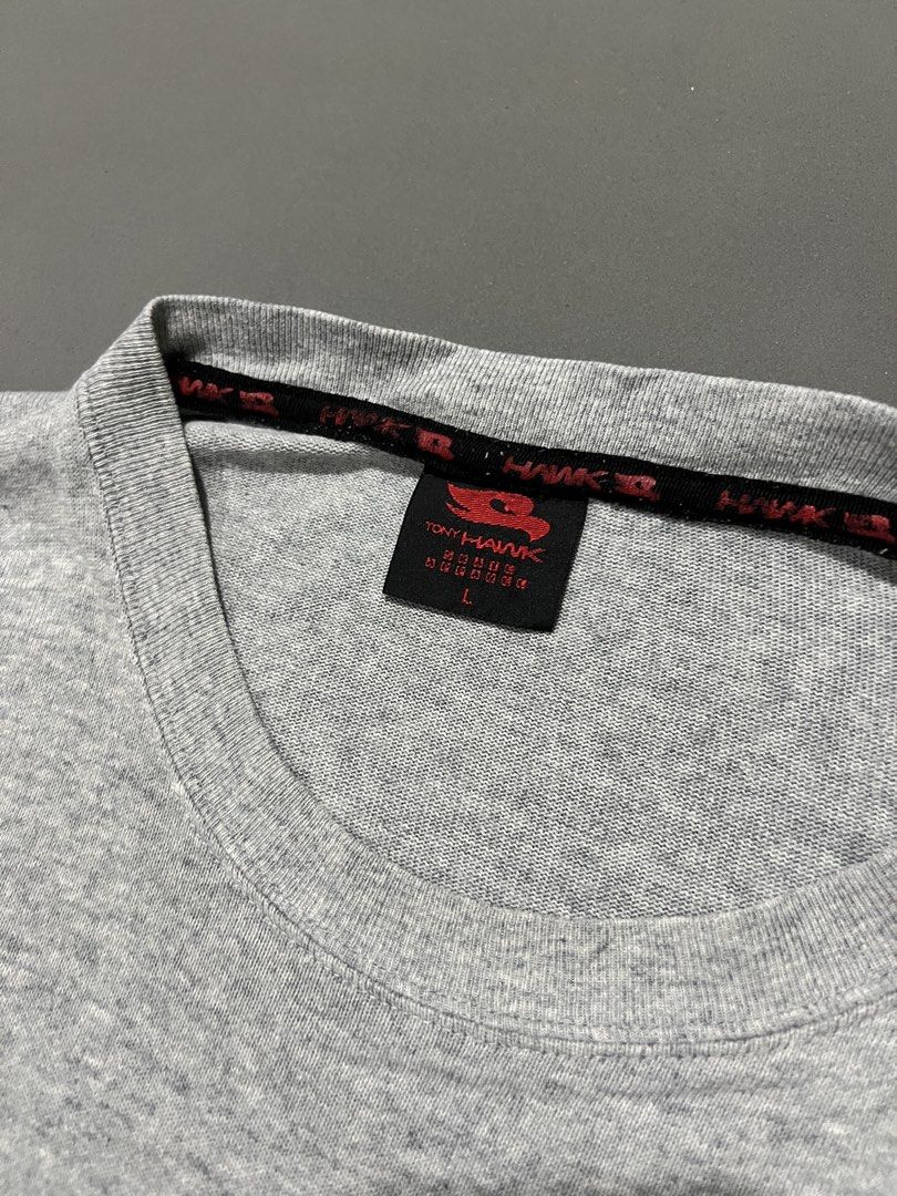 Tony Hawk Skateboard Tshirt (with pockets) (Category: Tshirts & Polo Shirts ) located in Paniqui. Submitted by rad_thrifts (Listing ID 1464508007, Image 3). Description: Y2k Tony Hawk Skateboard Tshirt (With pockets) Price: 300₱+sf Issues: Crackprints, writing under hem Measurements📐 Size on tag: L Width: 21” Length: 27” Sleeve length: 8” Sleeve opening:8” -Good quality cotton Color may vary due to lighting For any questions or other inquiries k