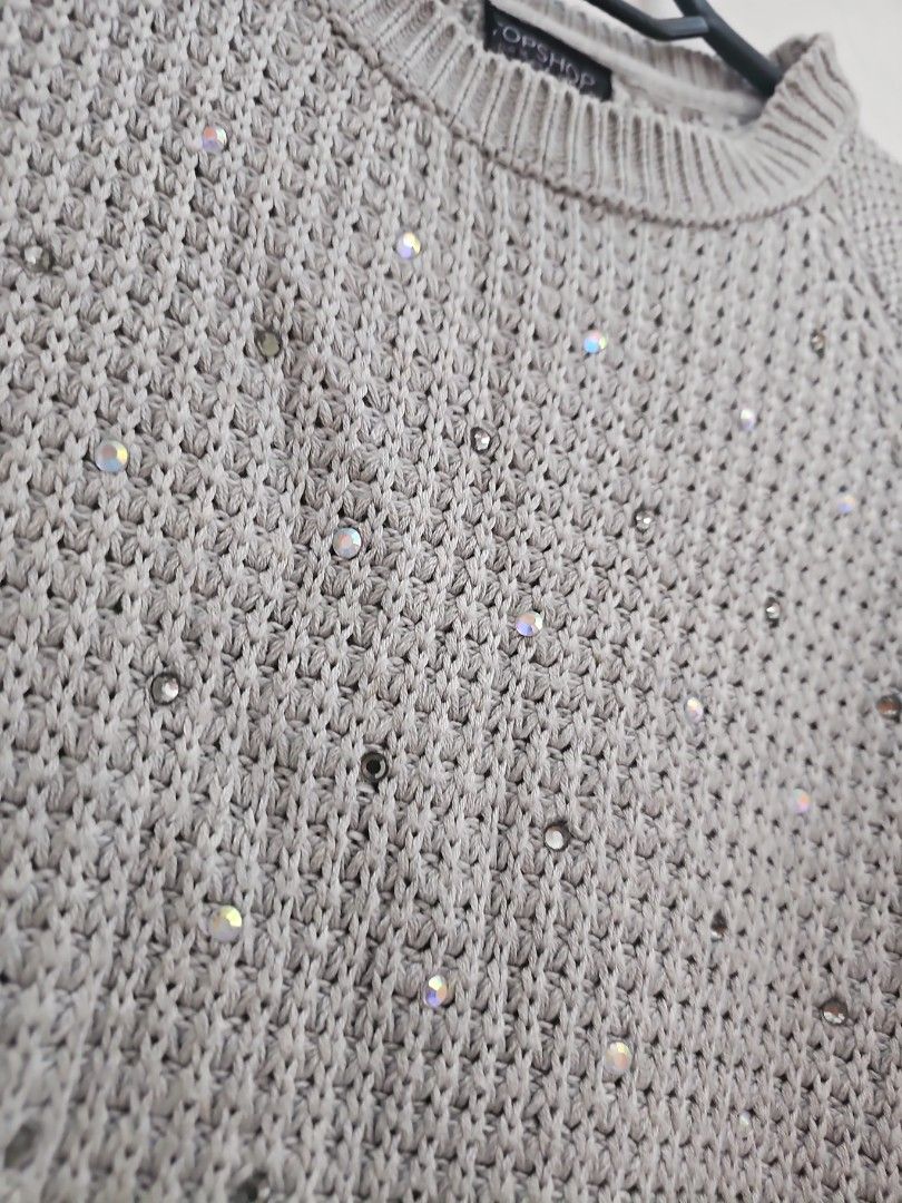 Topshop Grey Sequin Knit Sweater (Category: Coats, Jackets and Outerwear) located in Muntinlupa City. Submitted by shoptitak (Listing ID 1464397864, Image 3). Description: - Grey knit sweater from Topshop - Textured knit with scattered silver sequins - Long sleeves with ribbed cuffs - Classic crew neckline - Effortlessly dresses up or down - Adds a touch of sparkle to any outfit.