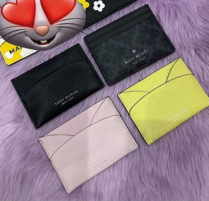 Tory Burch, Kate Spade, and other Cardholders (Category: Wallets & Card holders) located in Caloocan City. Submitted by ericavi_g (Listing ID 1464370943, Image 1). Description: - Set of 4 genuine leather cardholders - Includes: Black Tory Burch, Black Kate Spade, Pink, Yellow - Ideal for keeping your cards organized and accessible - Stylish and practical for everyday use.